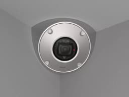AXIS Q9216-SLV from AXIS COMMUNICATIONS - in stainless steel, mounted in a corner with gray walls